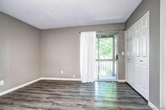 18131 E Arizona Ave Unit F, Aurora, CO 80017 - entryway with wood finished floors and a textured ceiling