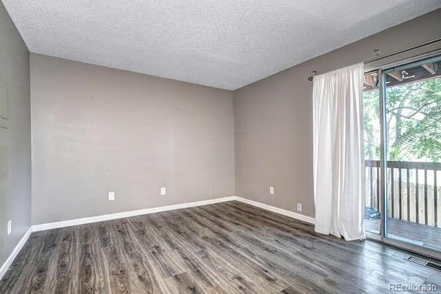 18131 E Arizona Ave Unit F, Aurora, CO 80017 - spare room with wood finished floors and a textured ceiling