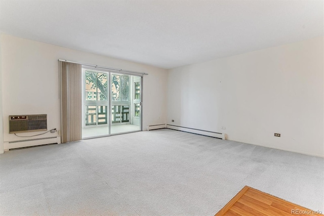 620 S Alton Way Unit 5B, Denver, CO 80247 - carpeted spare room featuring a baseboard radiator and an AC wall unit