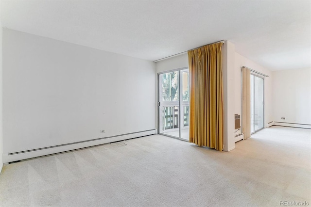 620 S Alton Way Unit 5B, Denver, CO 80247 - carpeted empty room featuring a baseboard radiator