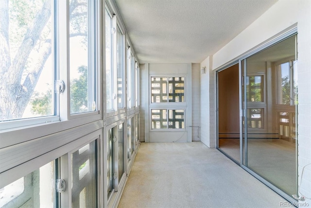 620 S Alton Way Unit 5B, Denver, CO 80247 - unfurnished sunroom with a baseboard heating unit