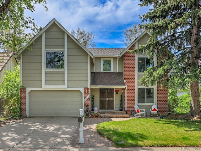 view of front of house with driveway, an attached garage, roof with shingles, brick siding, and a front yard