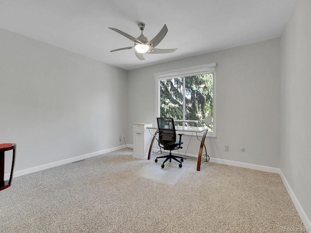 office area with carpet flooring, ceiling fan, and baseboards