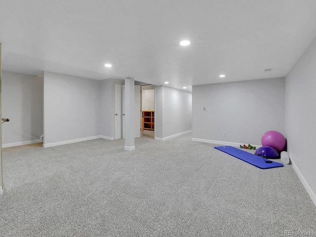 finished below grade area featuring carpet flooring, baseboards, and recessed lighting