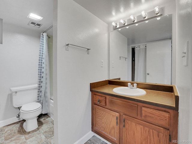 full bathroom with baseboards, toilet, and vanity
