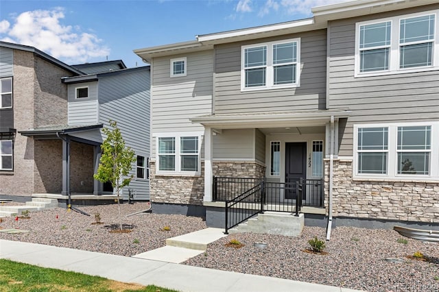 view of front of house with stone siding