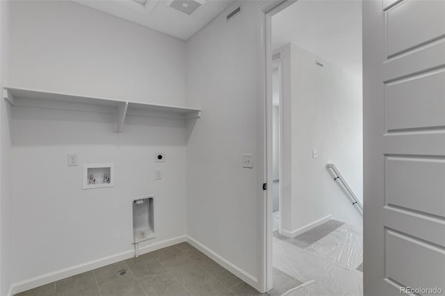 laundry area with hookup for a washing machine, electric dryer hookup, and baseboards