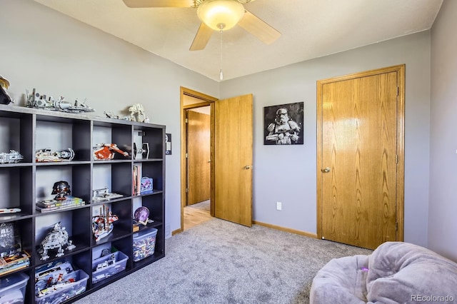 1065 6th St, Berthoud, CO 80513 - living area featuring carpet, a ceiling fan, and baseboards