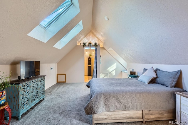 1065 6th St, Berthoud, CO 80513 - bedroom with a skylight, a textured ceiling, carpet, and lofted ceiling