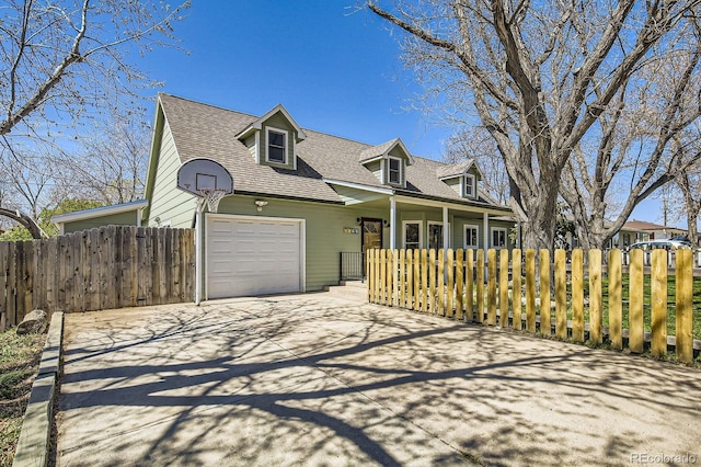 1065 6th St, Berthoud, CO 80513 - cape cod-style house with roof with shingles, a garage, concrete driveway, and covered porch