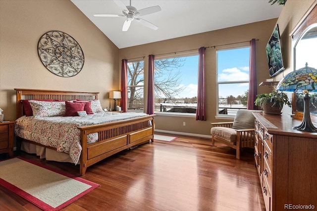 bedroom featuring wood-type flooring, ceiling fan, and vaulted ceiling