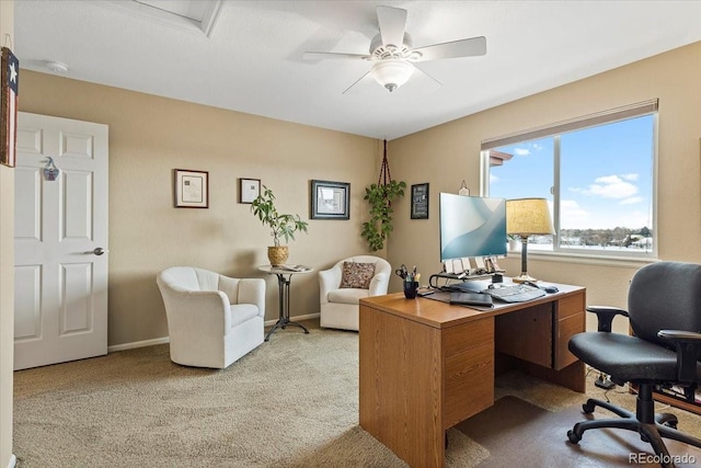 carpeted office space with ceiling fan