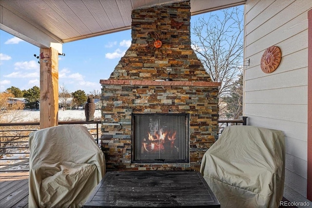 view of patio / terrace with exterior fireplace and a grill