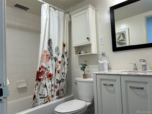 full bathroom featuring vanity, toilet, and shower / tub combo with curtain