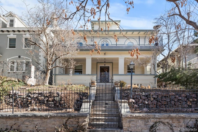 view of front of property with a balcony