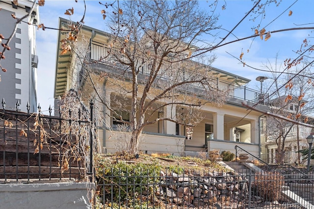 view of home's exterior with a balcony