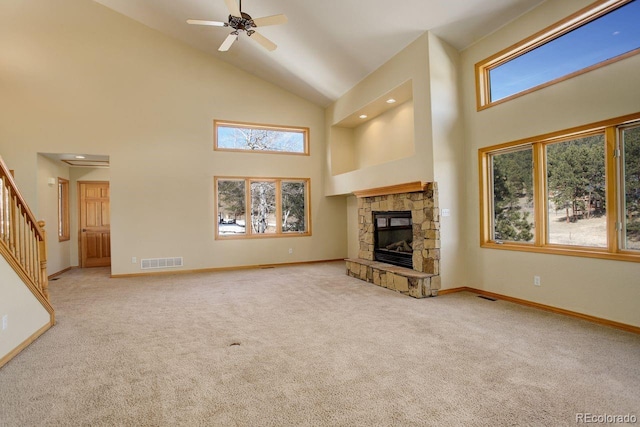 unfurnished living room featuring visible vents, baseboards, carpet, and a fireplace