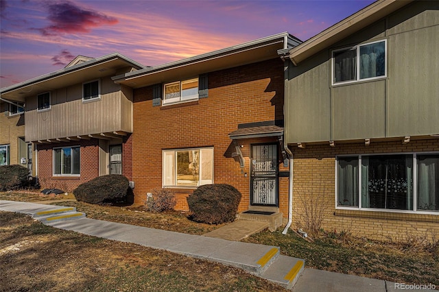 multi unit property featuring brick siding