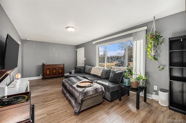 living room with light wood-style floors and baseboards