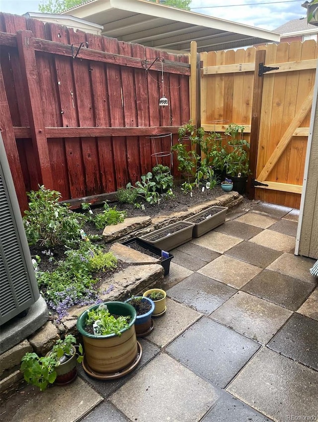 view of patio featuring cooling unit and fence