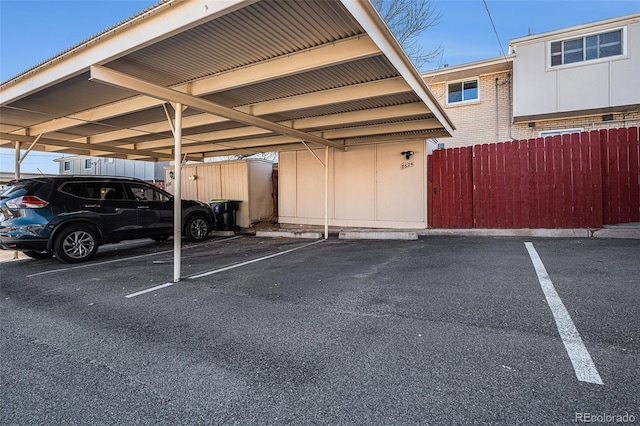 covered parking lot with fence