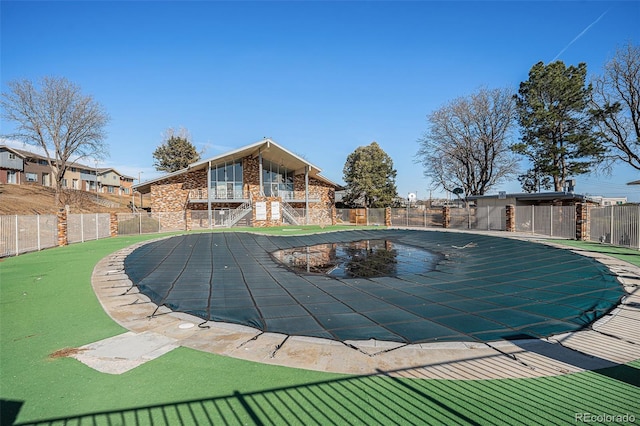 view of pool featuring a patio area, fence, and a fenced in pool