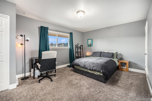 bedroom with carpet flooring and baseboards