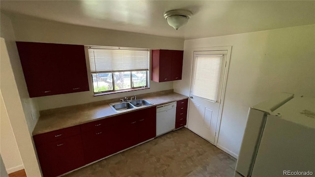 kitchen featuring sink and white dishwasher