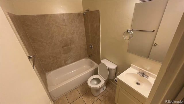 full bathroom with vanity, toilet, tile patterned flooring, and tiled shower / bath combo