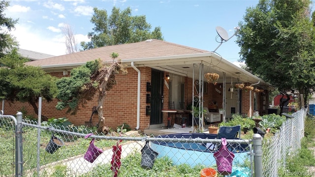 exterior space featuring a fenced in pool