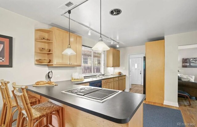 6235 E 6th Avenue Parkway, Denver, CO 80220 - kitchen featuring a peninsula, light wood-style flooring, a sink, light brown cabinetry, and stovetop with downdraft