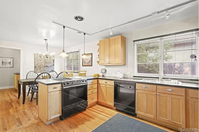 6235 E 6th Avenue Parkway, Denver, CO 80220 - kitchen with a peninsula, light brown cabinetry, a sink, rail lighting, and black appliances