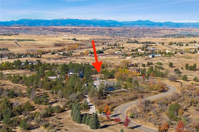 drone / aerial view featuring a mountain view