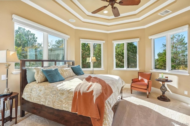 carpeted bedroom with ceiling fan, multiple windows, and crown molding