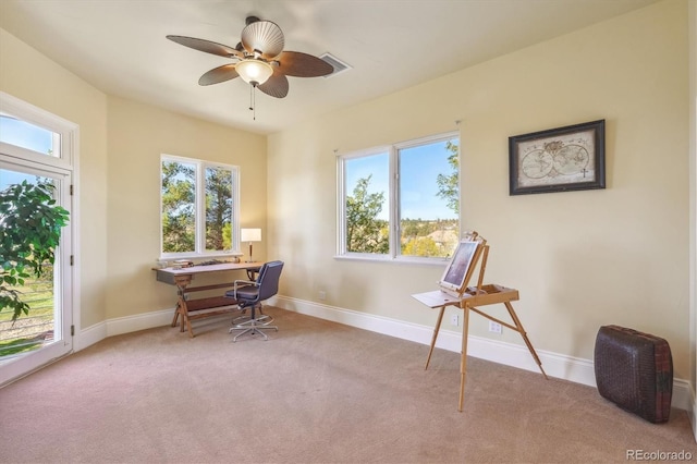 misc room with ceiling fan and light colored carpet