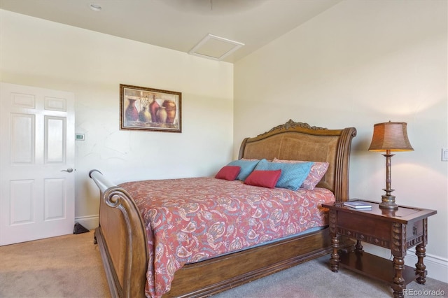 bedroom with carpet floors and lofted ceiling