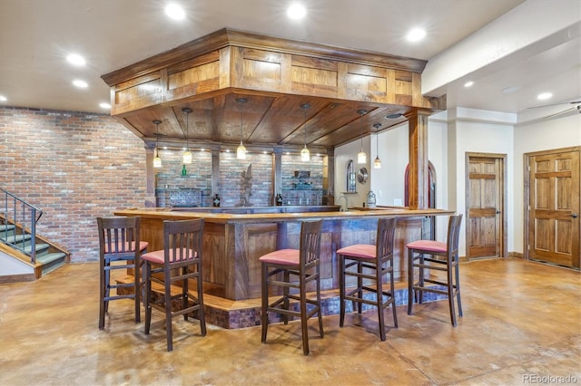 bar with brick wall and pendant lighting