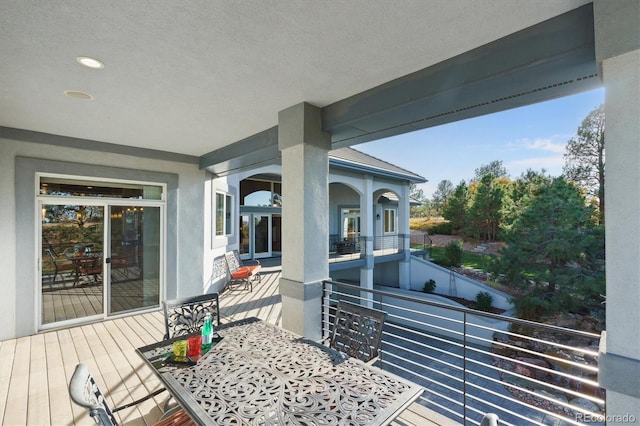 view of patio featuring a balcony