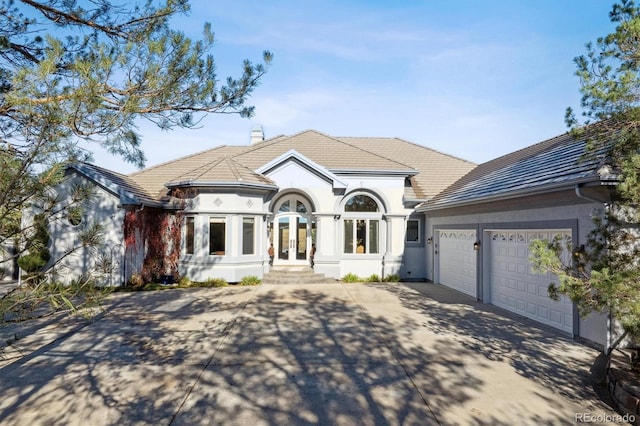 view of front of property with a garage