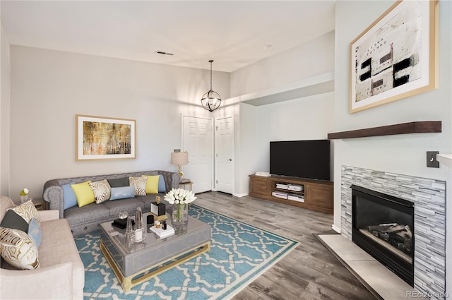 living room featuring hardwood / wood-style floors and a chandelier