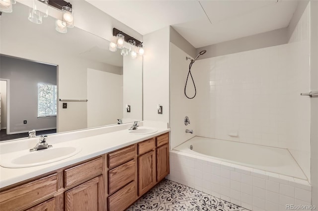 bathroom featuring tile patterned floors, vanity, and tiled shower / bath combo