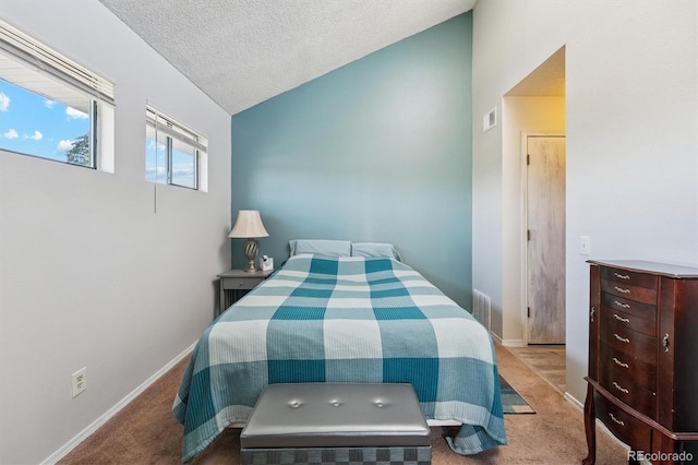 1845 Kendall St Unit 325D, Denver, CO 80214 - carpeted bedroom featuring lofted ceiling and a textured ceiling