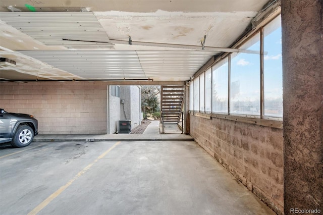 1845 Kendall St Unit 325D, Denver, CO 80214 - parking deck featuring concrete block wall