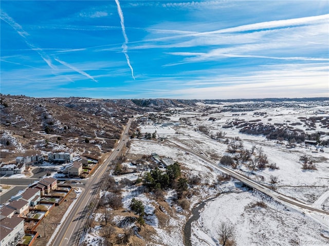 snowy aerial view featuring a mountain view