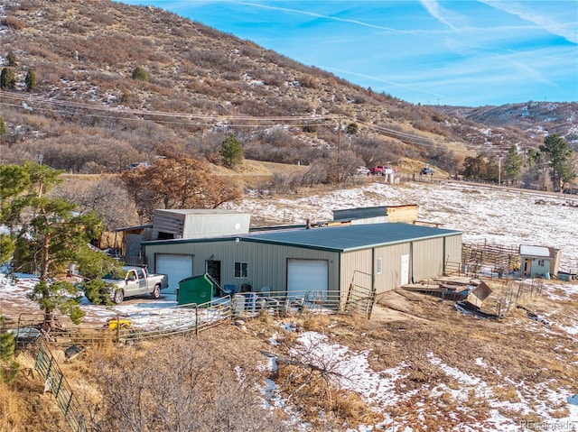 exterior space featuring a mountain view and an outdoor structure