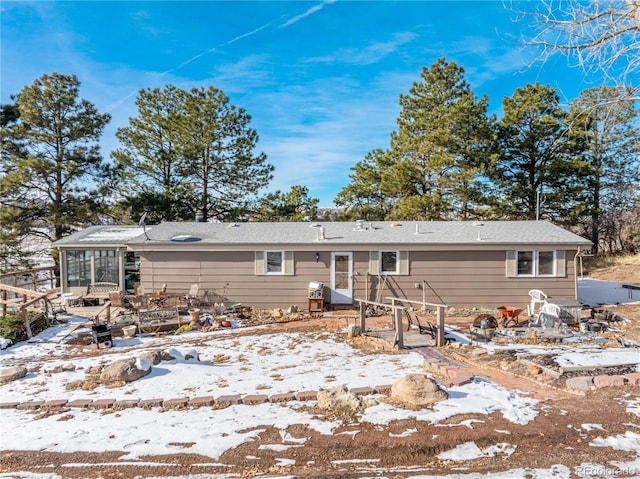 567 Lake Gulch Rd, Castle Rock, CO 80104 - snow covered rear of property featuring a wooden deck