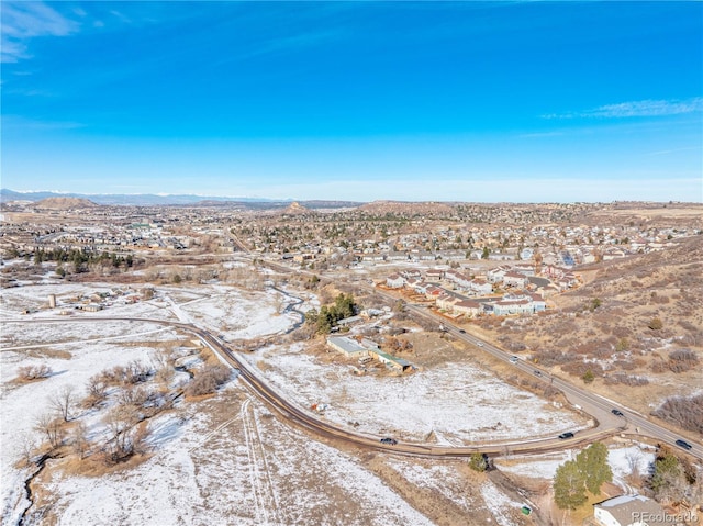 birds eye view of property with a mountain view