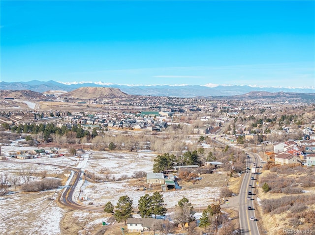 birds eye view of property with a mountain view