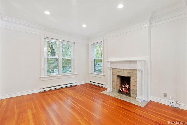 1355 N Franklin St Unit 5, Denver, CO 80218 - unfurnished living room with a baseboard radiator, crown molding, a tiled fireplace, wood finished floors, and recessed lighting