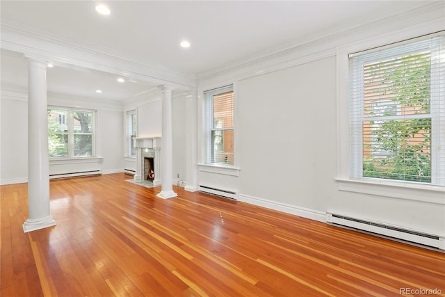1355 N Franklin St Unit 5, Denver, CO 80218 - unfurnished living room with ornate columns, baseboard heating, a fireplace with flush hearth, ornamental molding, and recessed lighting